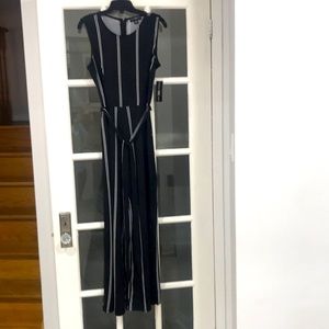 Black with white stripes one piece pant jumper, belt and zipper in back